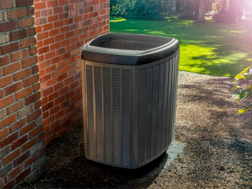 An air conditioner unit outside a Belchertown home