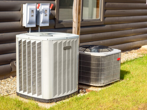 An AC and heat pump outside a Belchertown, MA home
