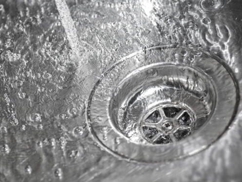 A clear running drain in Belchertown.